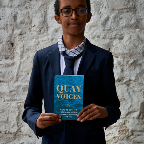 Mohamed Yahie proudly displays his copy of Quay Voices #1